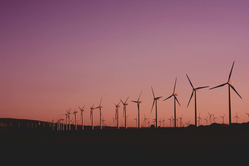 Silhouetted wind turbines at sunset in Zahara de los Atunes, Spain.